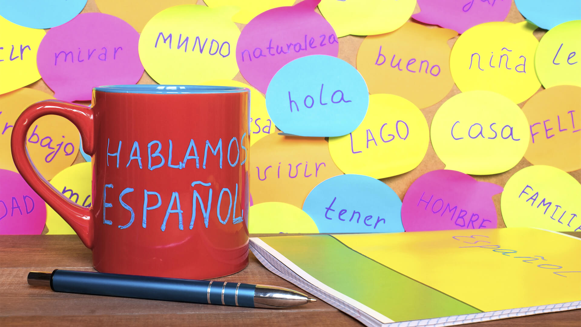 Postits and mug with spanish words on them