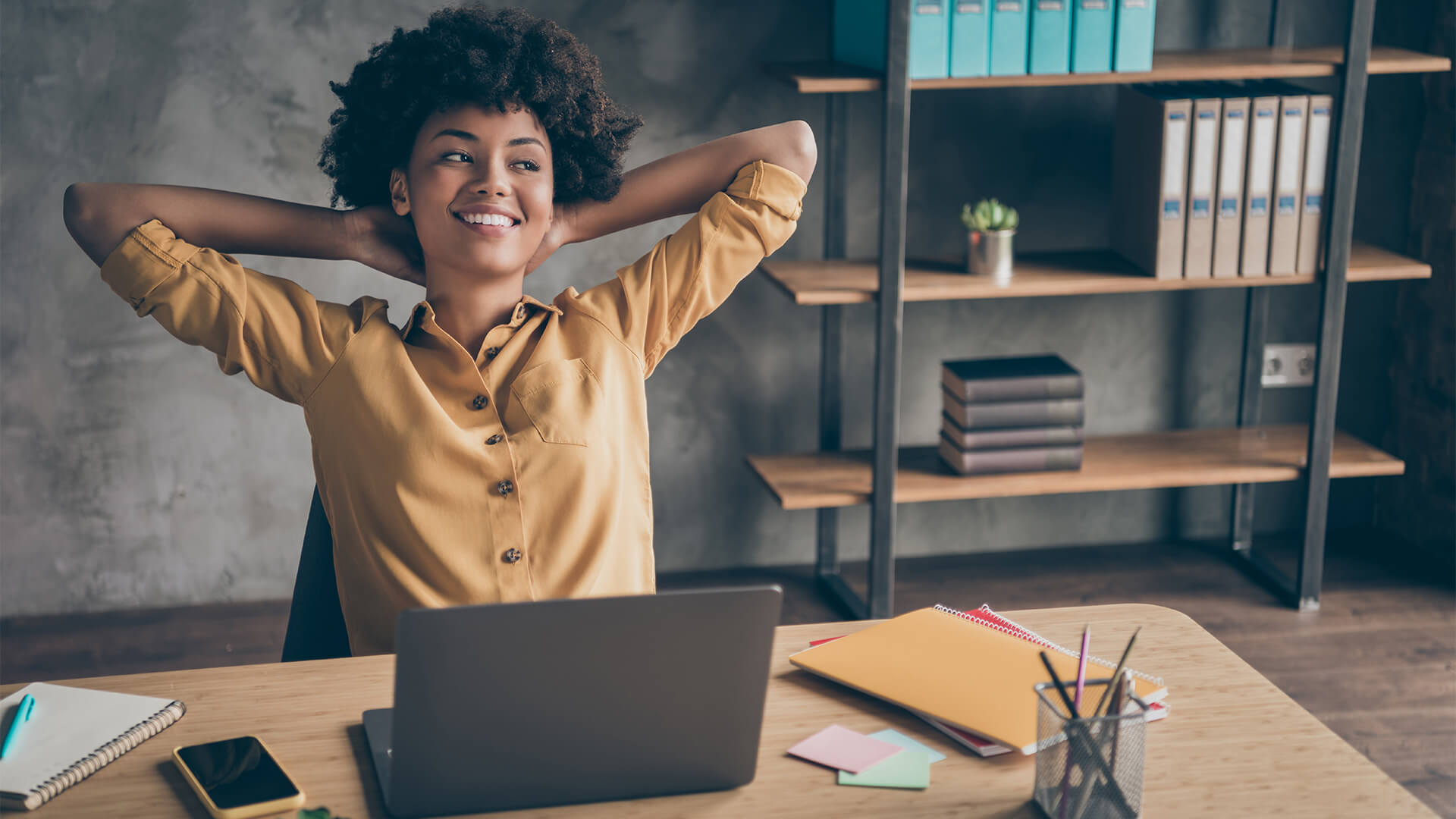 Woman relaxed and happy at her desk